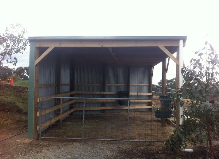 Open-front shed with gates